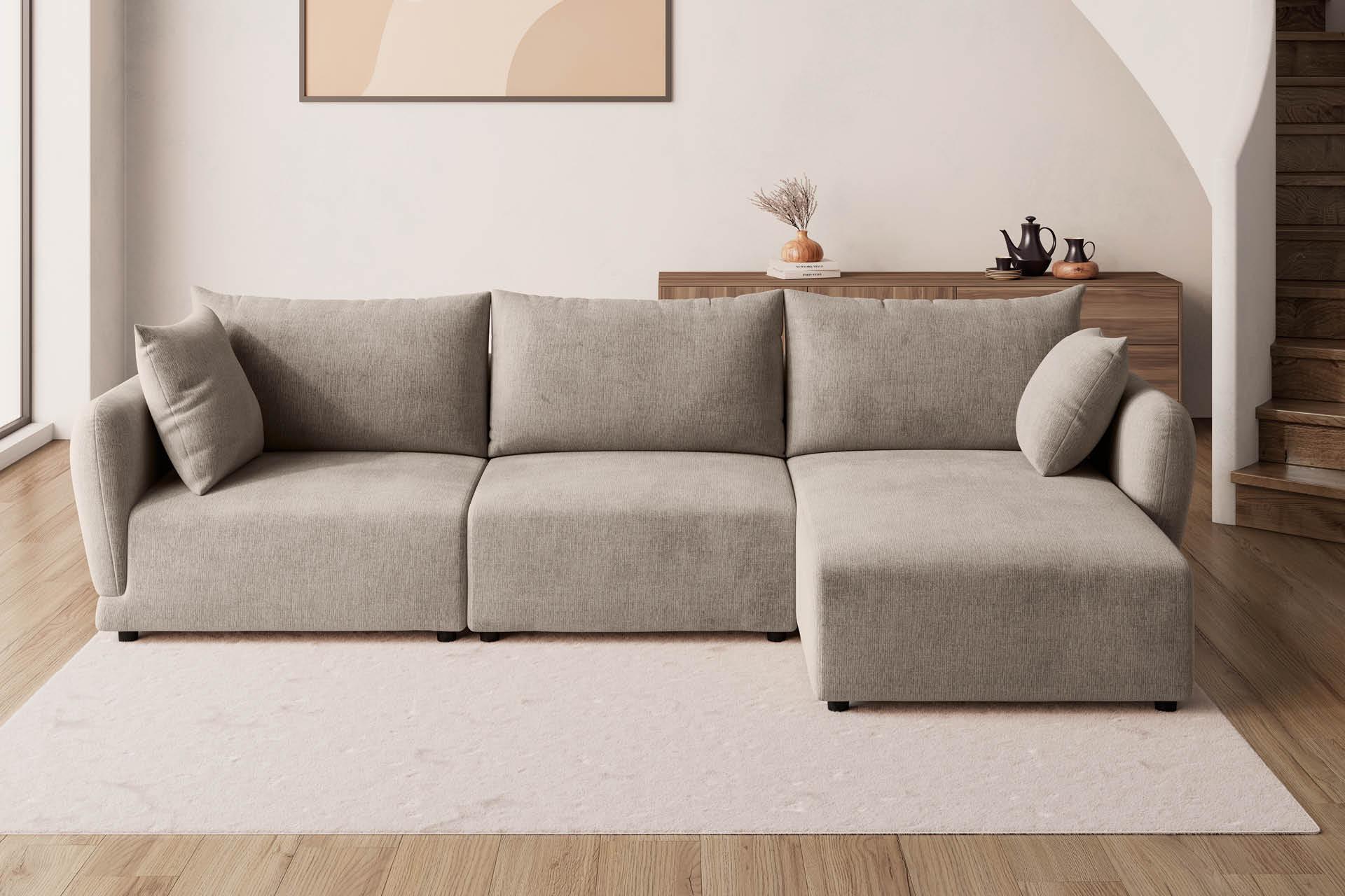 Graue Wohnlandschaft auf weißem Teppich