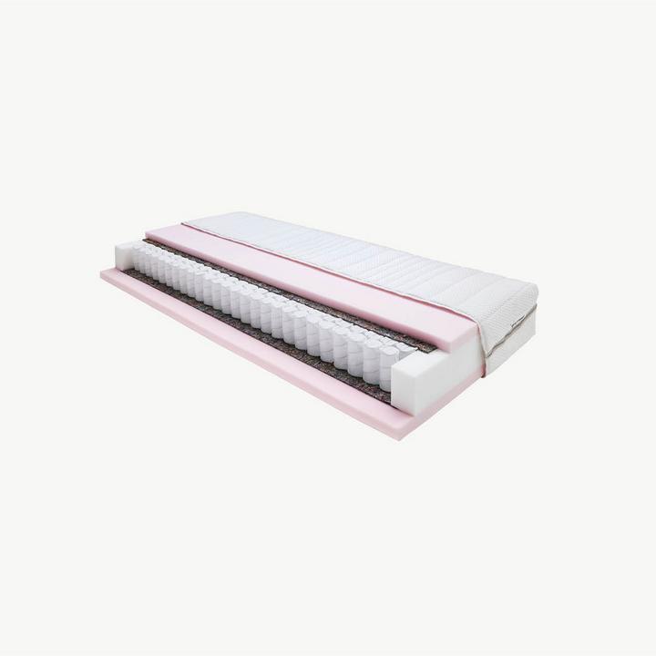 Querschnitt einer Taschenfederkernmatratze mit rosa Auflage vor grauem Hintergrund
