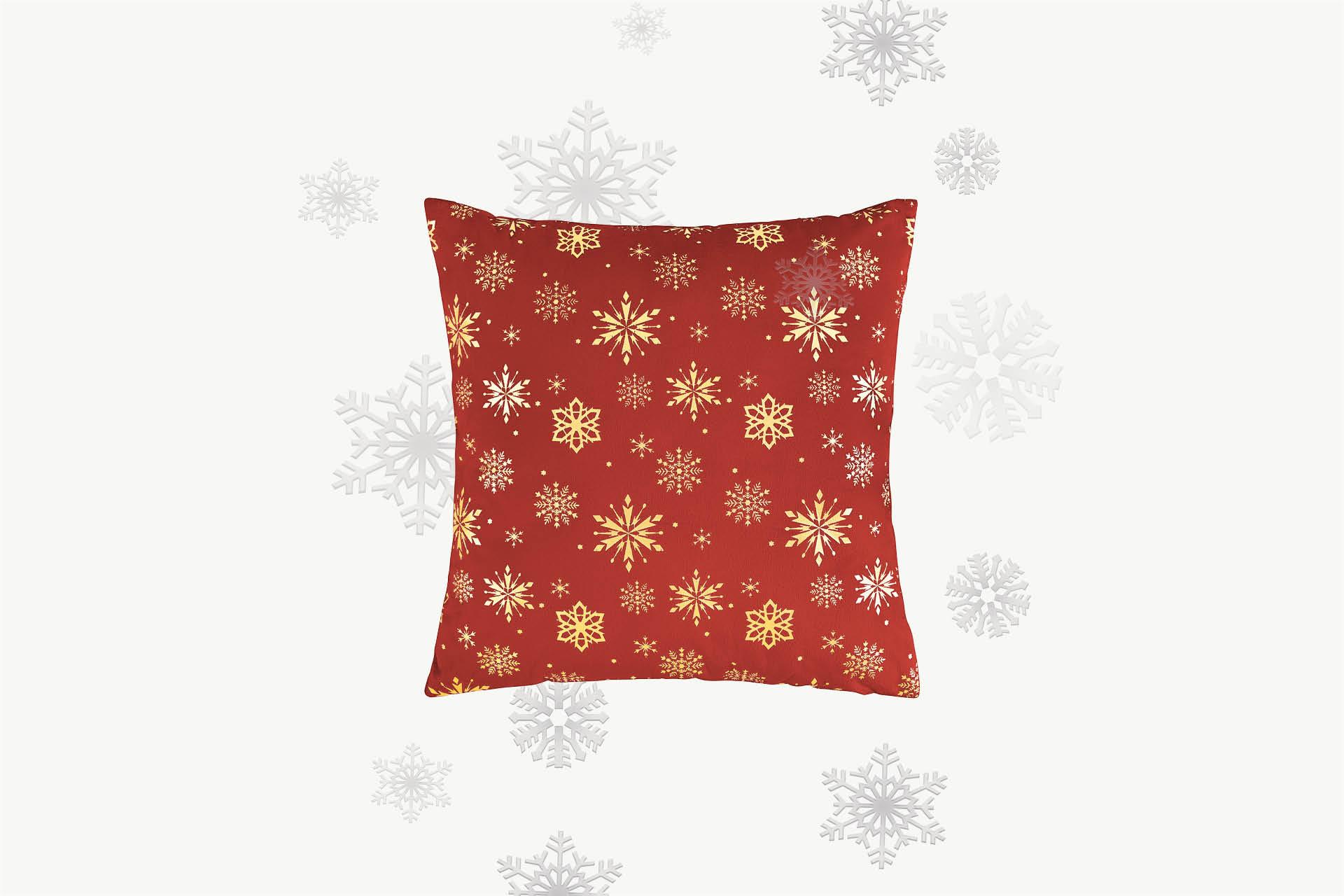 Rotes Kissen mit gelben Weihnachtssternen