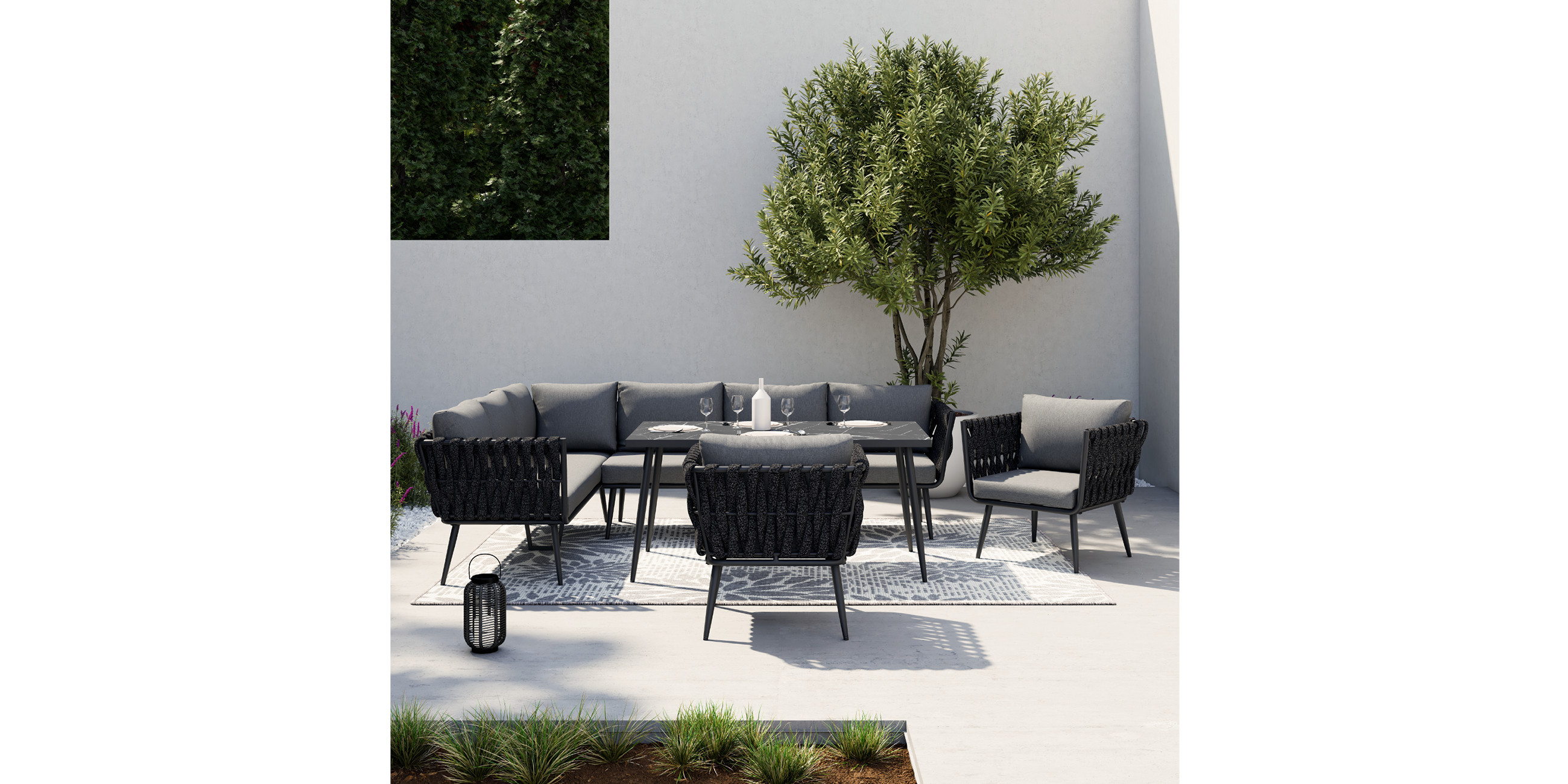 Dunkelgraue Loungegarnituren mit grauen Kissen und schwarzem Tisch