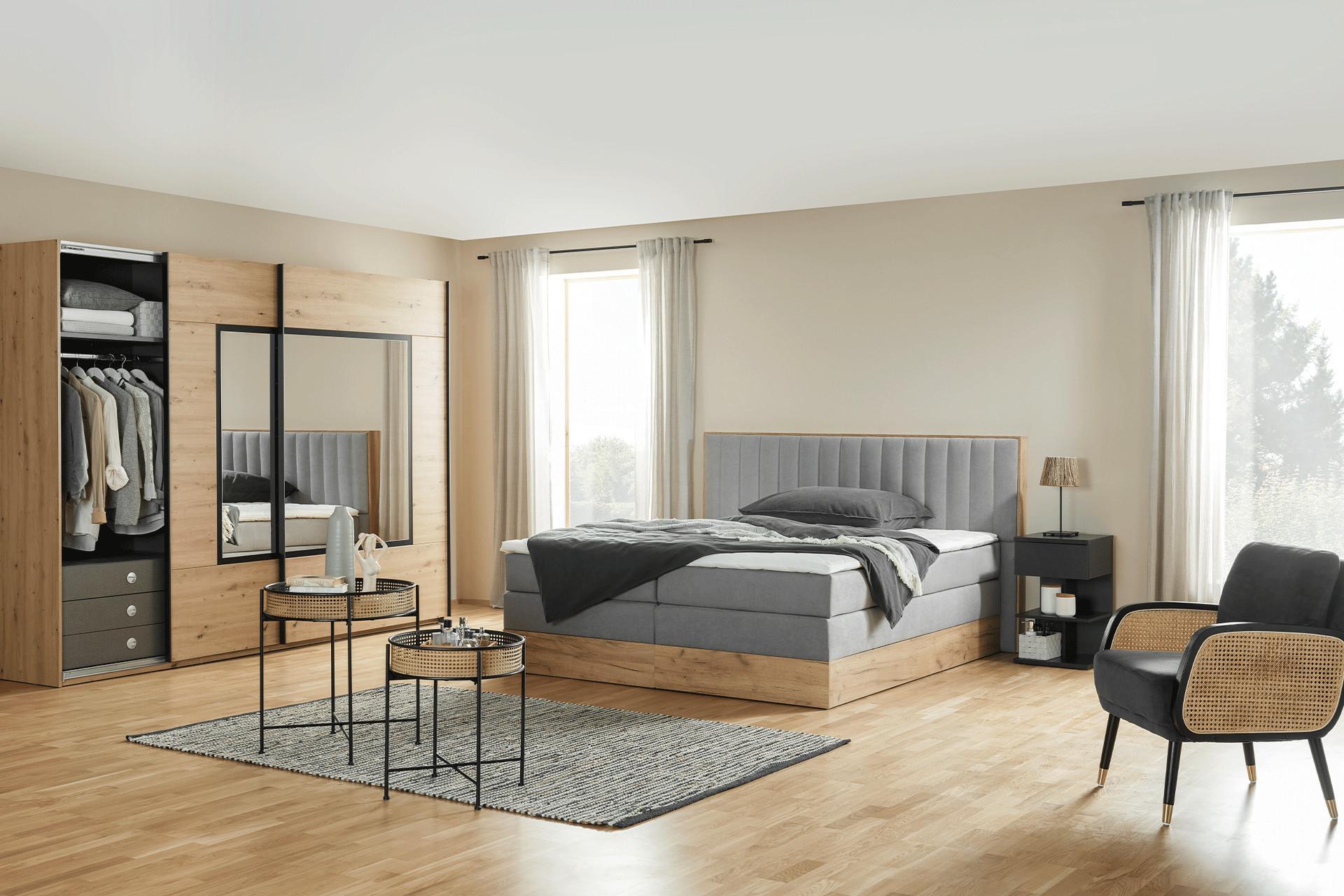 Schlafzimmerserie mit Kleiderschrank und Boxspringbett aus Holz von mömax 