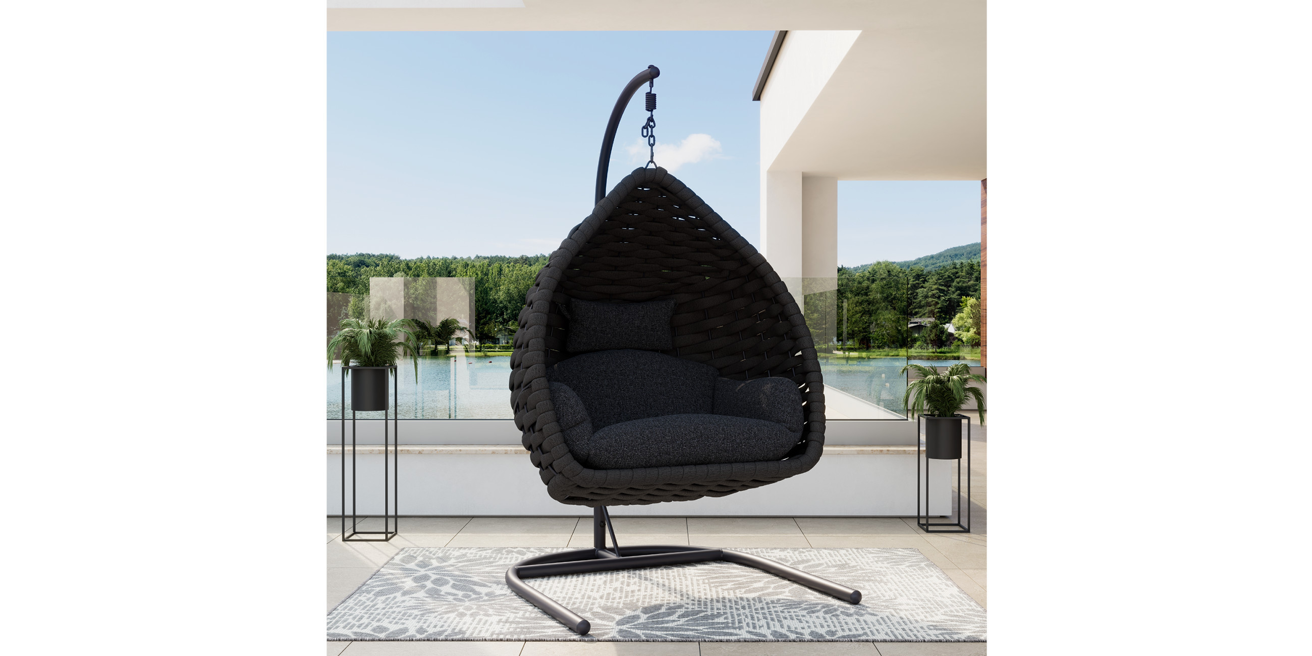 Schwarzer Hängesessel auf grauem Outdoorteppich