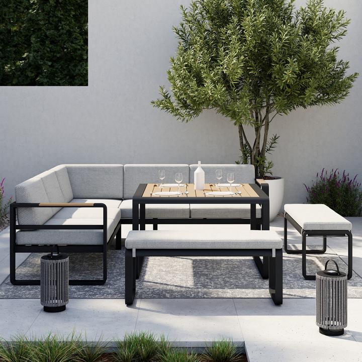 Graue Loungegarnitur mit hohem Tisch aus Holz