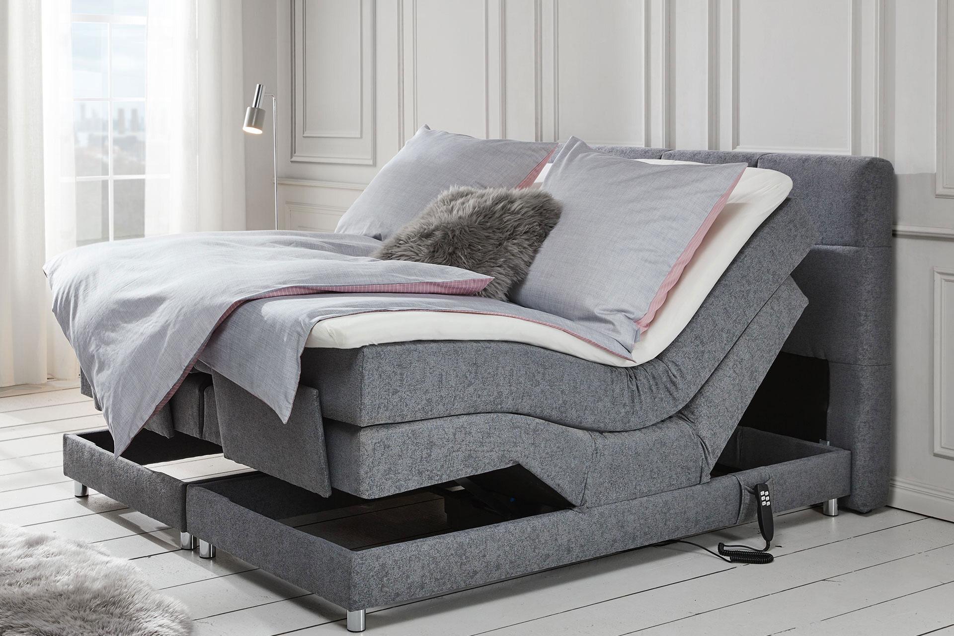 Graues Boxspringbett mit Lattenrost und Motorverstellung für extra Komfort von moemax