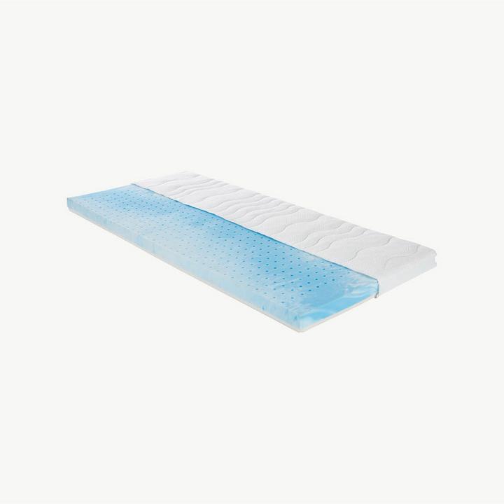 Weiß-blauer Gelschaum-Topper vor grauem Hintergrund
