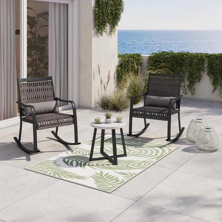 Dunkelgraues Balkonset mit schwarz weißem runden Beistelltisch